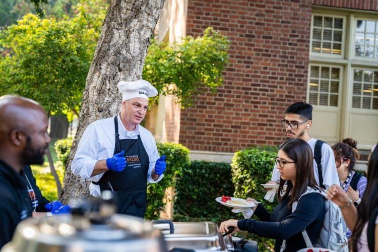 Eberhardt School of Business students are treated to "pancakes with the dean" during Week of Welcome in 2023. 